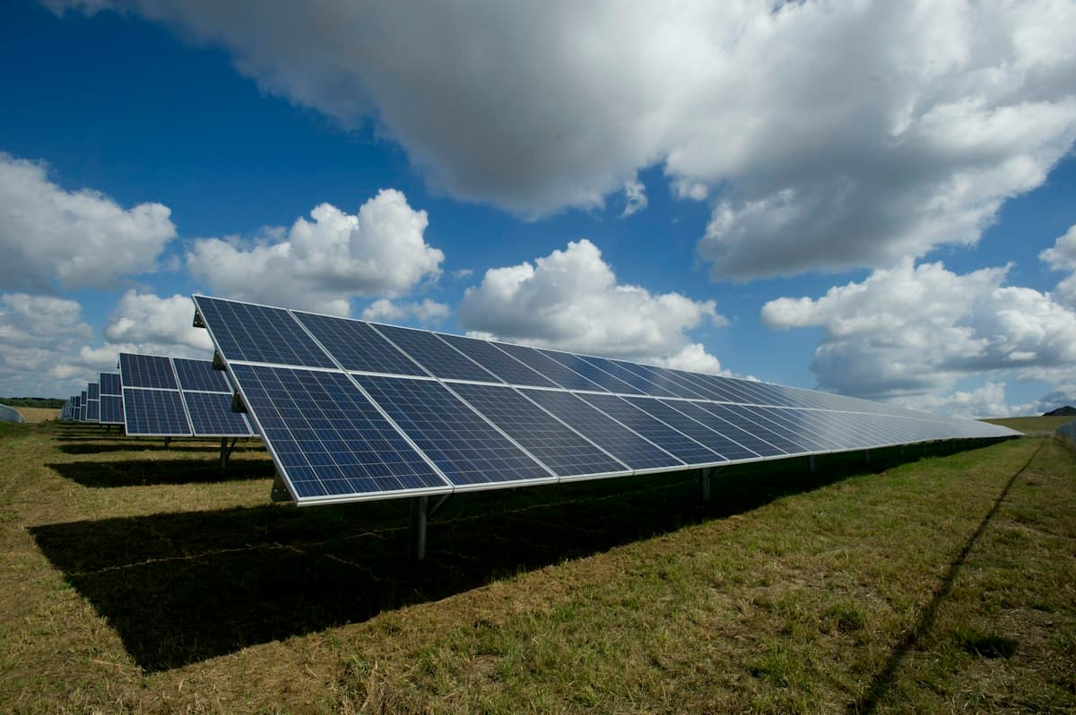 Vast rooftop solar panels field at sunset